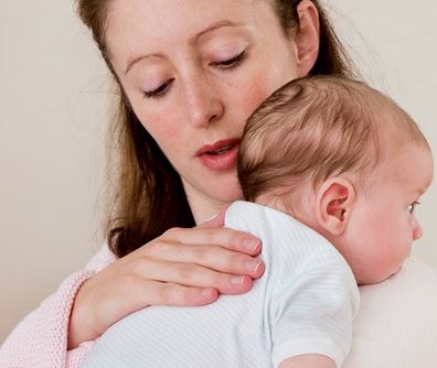 Burping a baby to stop excessive bloating